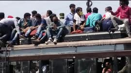Migrant workers flee on crowded buses to avoid coronavirus curfew in India