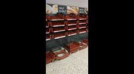 Empty bread shelves at Tesco branch Stroud