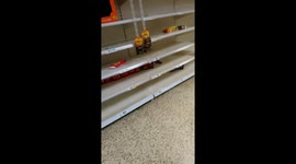 Empty crisp shelves in a branch of Tesco's in Stroud.