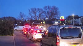 Huge queue for McDonalds drive thru in Kent just before official closing.