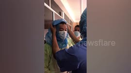 Malaysian medical staff use plastic bags as protection due to shortage of supplies