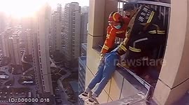 Chinese firefighters rescue alleged suicidal woman hanging from 32nd-floor balcony