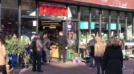 Coronavirus: It's one customer in, one customer out at this Amsterdam supermarket