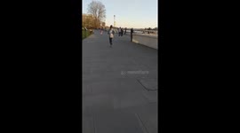 Reckless west Londoners ride Boris bikes and have fun in the sun ignoring advice to stay indoors