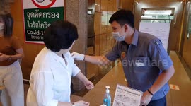 Office workers screened for COVID-19 in Bangkok as country declares 'state of emergency'