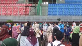 Crowds gather at soccer stadium for mass coronavirus testing in Indonesia