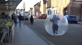 UK woman 'self-isolating' in ZORB BALL leaves shoppers bemused as she rolls around supermarket