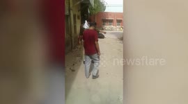 Amid 21-day-long nationwide lockdown to contain COVID-19 pandemic, police personnel bashes up violators on street in northern India