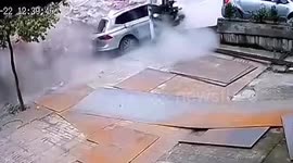 Bricks falling from transport truck after collision flatten car in south China