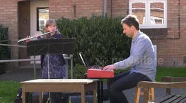 Musicians play pop classics outside retirement complex in heartwarming clip