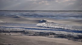 Frozen surf crashes onto the New York Atlantic coast during brutal Polar Vortex
