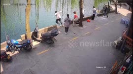 Chinese man leaps into river to save drowning boy who fell in moments before