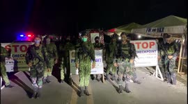 Filipino soldiers dance to stay upbeat while manning COVID-19 checkpoint