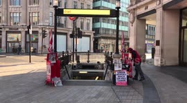 London Lockdown, Evening Standard newspaper distributor cries to an empty Oxford Street.