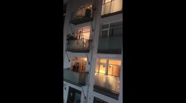 Londoners step onto their balconies to applaud NHS workers