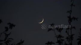 The new micro moon sets in the sky during sunset over London