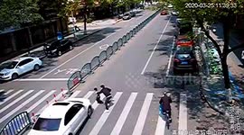 Chinese father's quick reactions save son from being run over by car at crossing