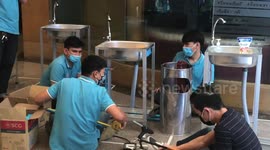 Office in Bangkok installs rows of emergency sinks for workers to wash hands during coronavirus outbreak
