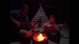 Cute moment dad creates INDOORS campfire during coronavirus lockdown