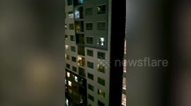 Apartment block residents clap for coronavirus health workers in Thailand