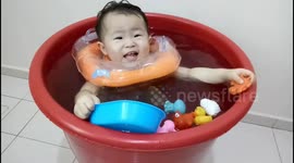 Adorable toddler enjoys his homemade baby spa