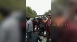 Passenger train in China derails and flips over due to landslide, killing one