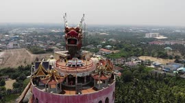 Stunning aerial footage of Buddhist temple with dragon coiled around the sides
