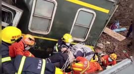 Firefighters rescue people trapped in derailed passenger train in southern China