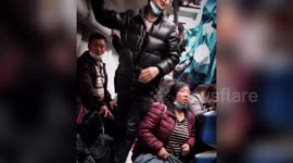 Passengers trapped in derailed train try to climb out of windows to escape in China