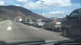 Venezuelans queue at petrol stations for miles as coronavirus causes gas panic