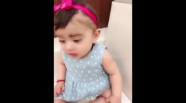 Baby girl tasting pickle for the first time!
