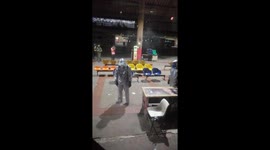 Cleaners spray Bangkok bus terminal with sanitiser liquid