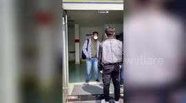 Three men apologise after aggressively jumping queue to have coronavirus tests in China