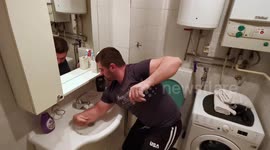 Man opens door with his TEETH to avoid touching it with clean hands during coronavirus lockdown in home