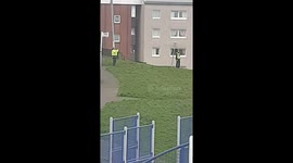 Posing police officers in Glasgow take photos on empty streets during COVID-19 lockdown