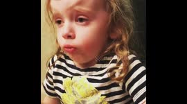 'I'm OK!' Four-year-old US girl tries extremely hard to enjoy her mum's cooking