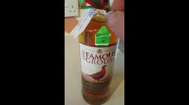 Man gets gift of whisky with tiny, tiny birthday card