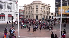 People protesting and marching towards the city center