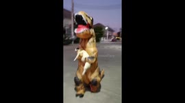 Thai woman wears dinosaur suit to walk pet dog during Covid-19 lockdown