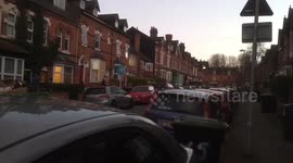 A street in Birmingham play 'lean on me' while clapping for the NHS