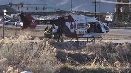 Mountain View corridor and 6200 south accident, loading critical condition patient into AirMed helicopter.
