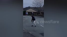 Neighbour plays saxophone in UK street during Covid-19 lockdown