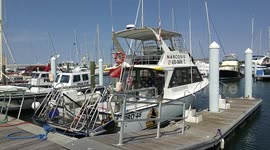 Diamond fishing charter boat sit idle at the Riviera Beach Marina Village in Riviera Beach Florida on Saturday April 4th 2020 as the coronavirus cripples the tourism industry