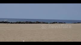 Woman surfer Lifeguard tells her the beaches closed venice beach