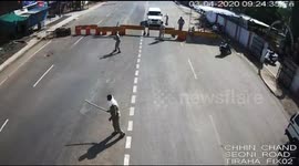 Moment speeding car smashes through police barricade defying Corona lockdown