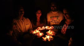 Indians switch off their lights and light candles in show of solidarity in fight against coronavirus