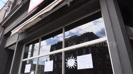 Toronto restaurant closed by COVID 19 coronavirus pandemic places signs in their windows encouraging people to stay home and hang in there