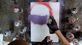 Spray paint artist creates 'out of this world' space artwork in minutes