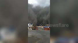 Huge sandstorm wall hits northeastern China