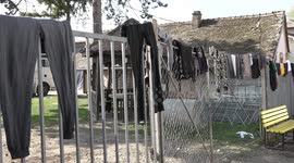 FILE - Refugees are stuck in camps along the Serbian Croatian border